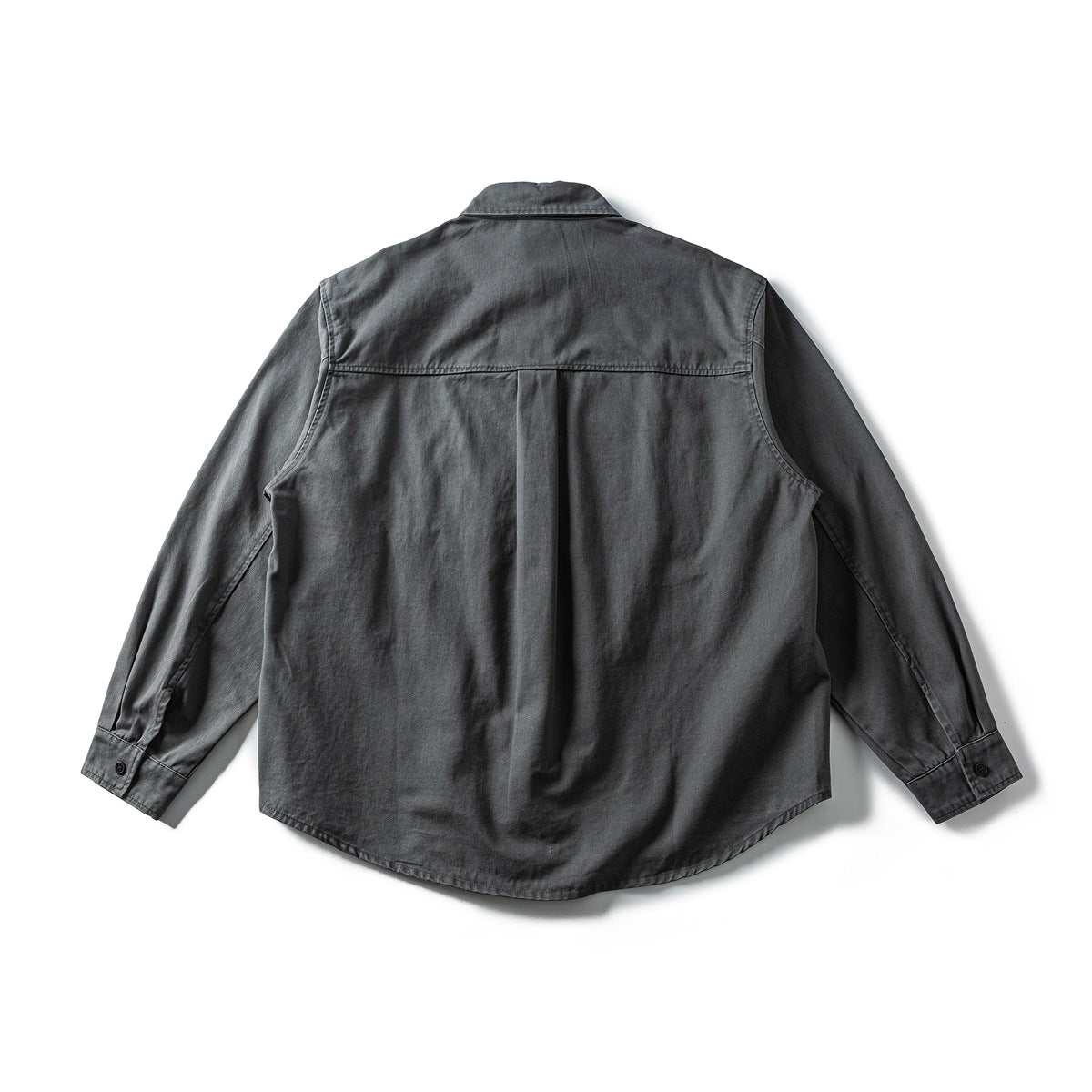 Back view of a charcoal long-sleeve button-up shirt with a center pleat and curved hem.