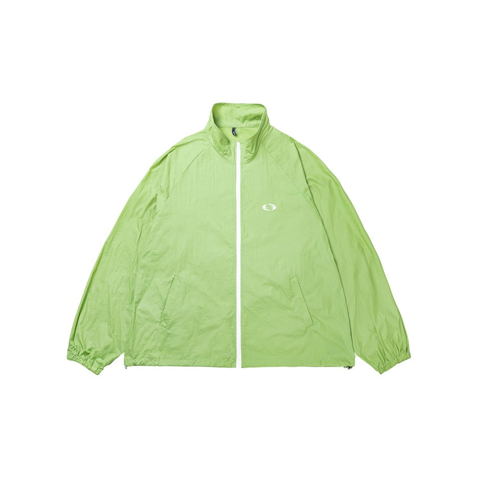 Lime green zip-front jacket with a stand collar, elastic cuffs, angled pockets, and a small white chest emblem, shown flat.
