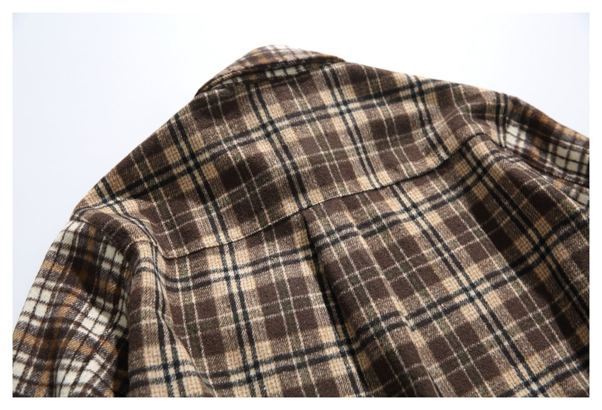 Close-up of the plaid shirt's back collar, shoulder seams and yoke.