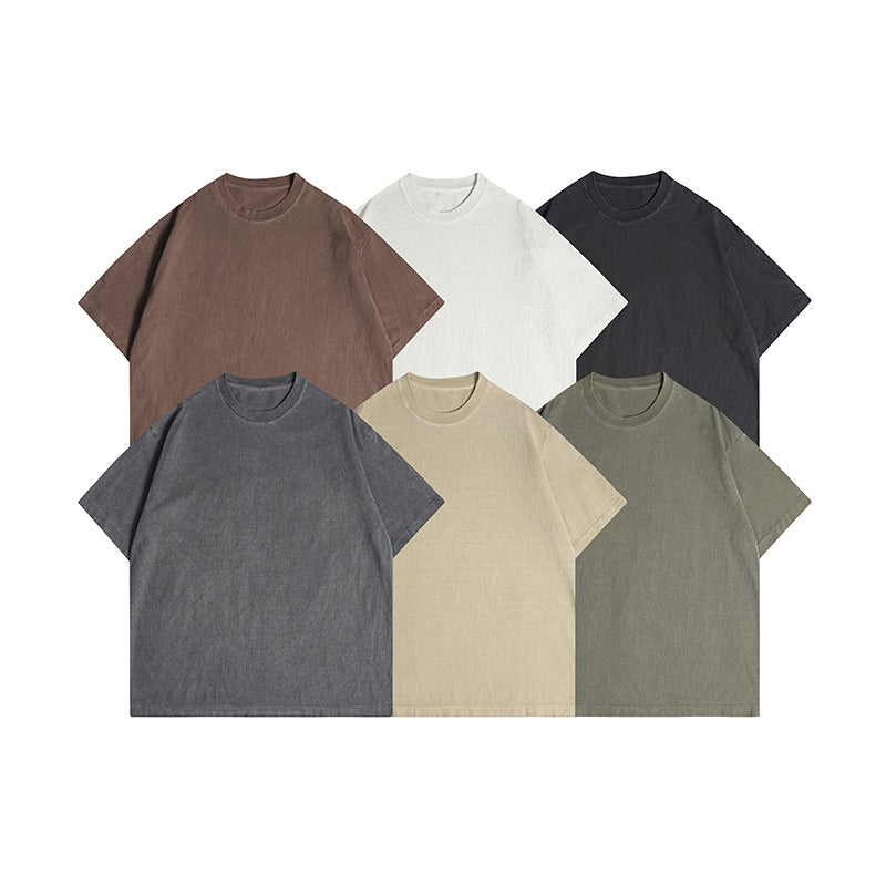 Six short-sleeve crew-neck T-shirts displayed together in brown, white, black, gray, beige, and olive.
