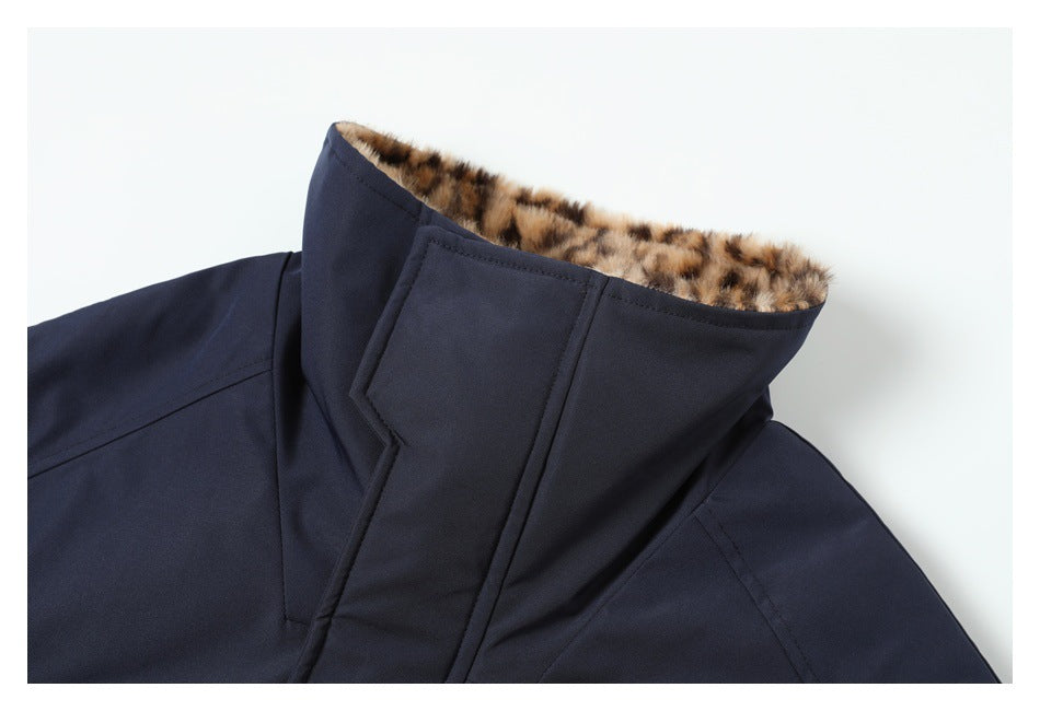 Close-up of a navy jacket collar lined with brown-and-black leopard-print fabric.