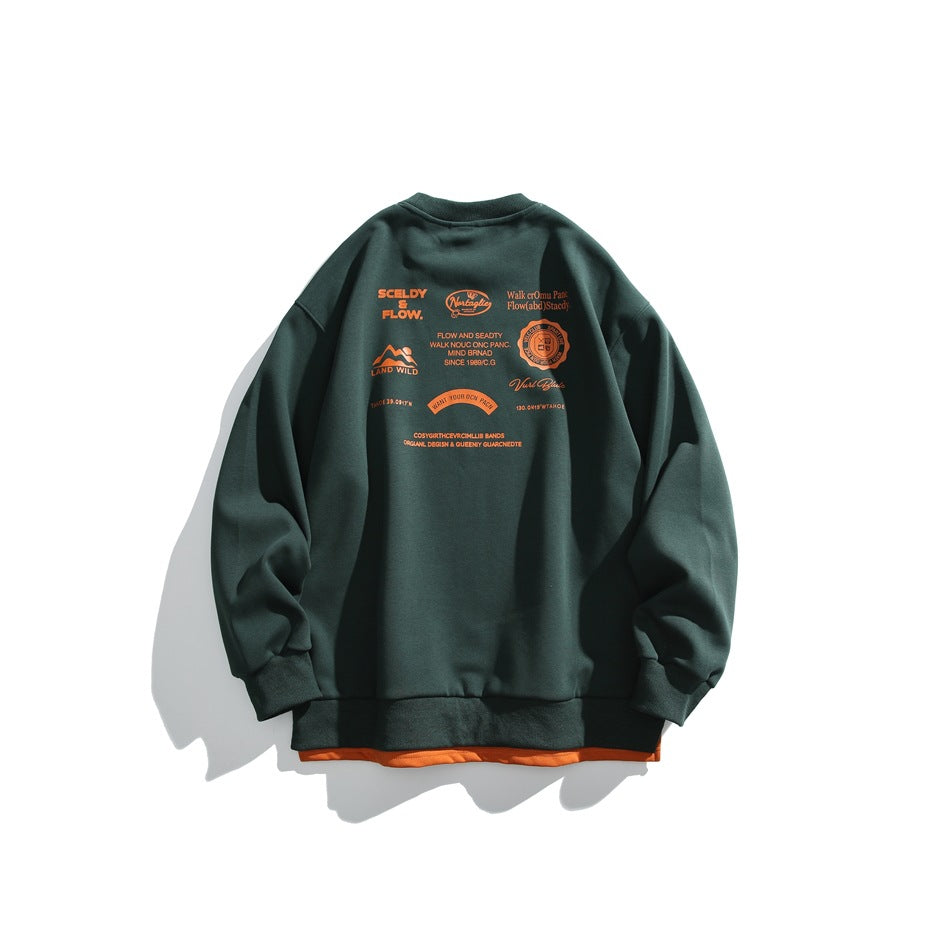 Back view of a dark green crewneck sweatshirt with a cluster of orange text and graphic prints across the upper back.