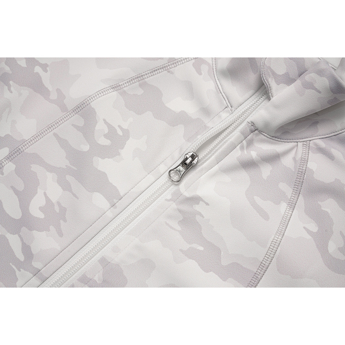 Close-up of the white camouflage jacket's front zipper pull and stitched panel seams.
