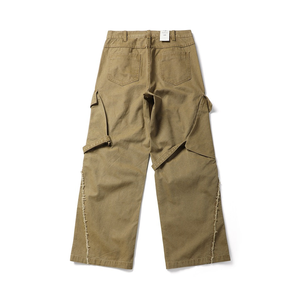 Back view of tan wide-leg cargo pants with two rear pockets, side cargo pockets and frayed outer seams.