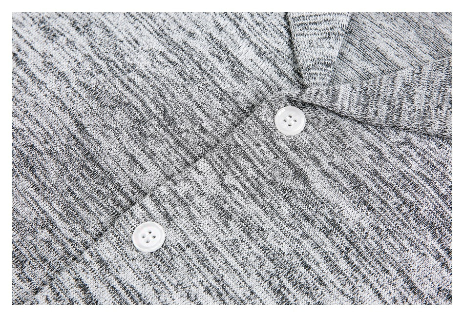 Close-up showing the heathered knit texture and white buttons on the shirt front.