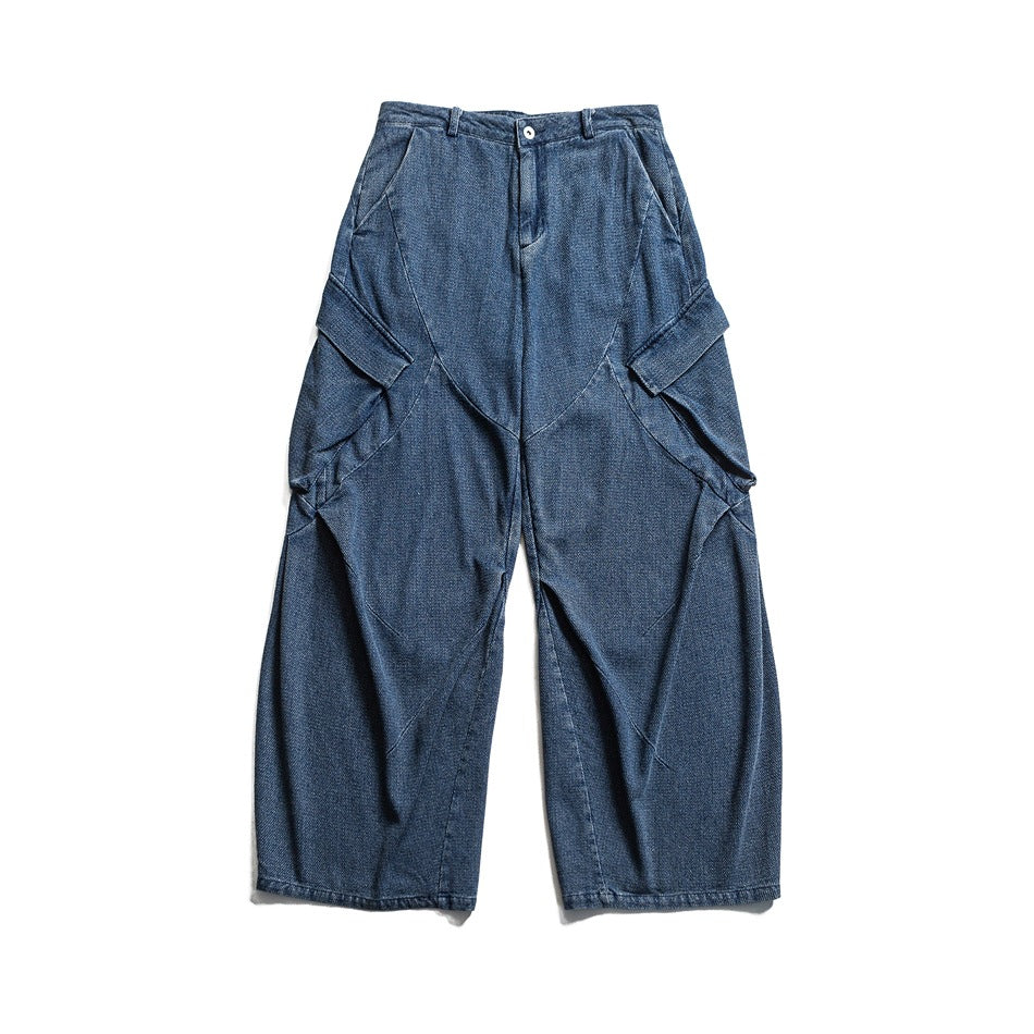 Navy blue wide-leg denim cargo pants with side flap pockets and curved seams, front flat lay