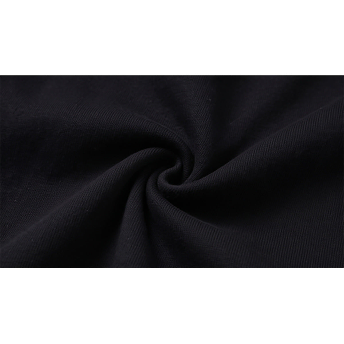 Macro close-up of black fabric gathered into a swirl.