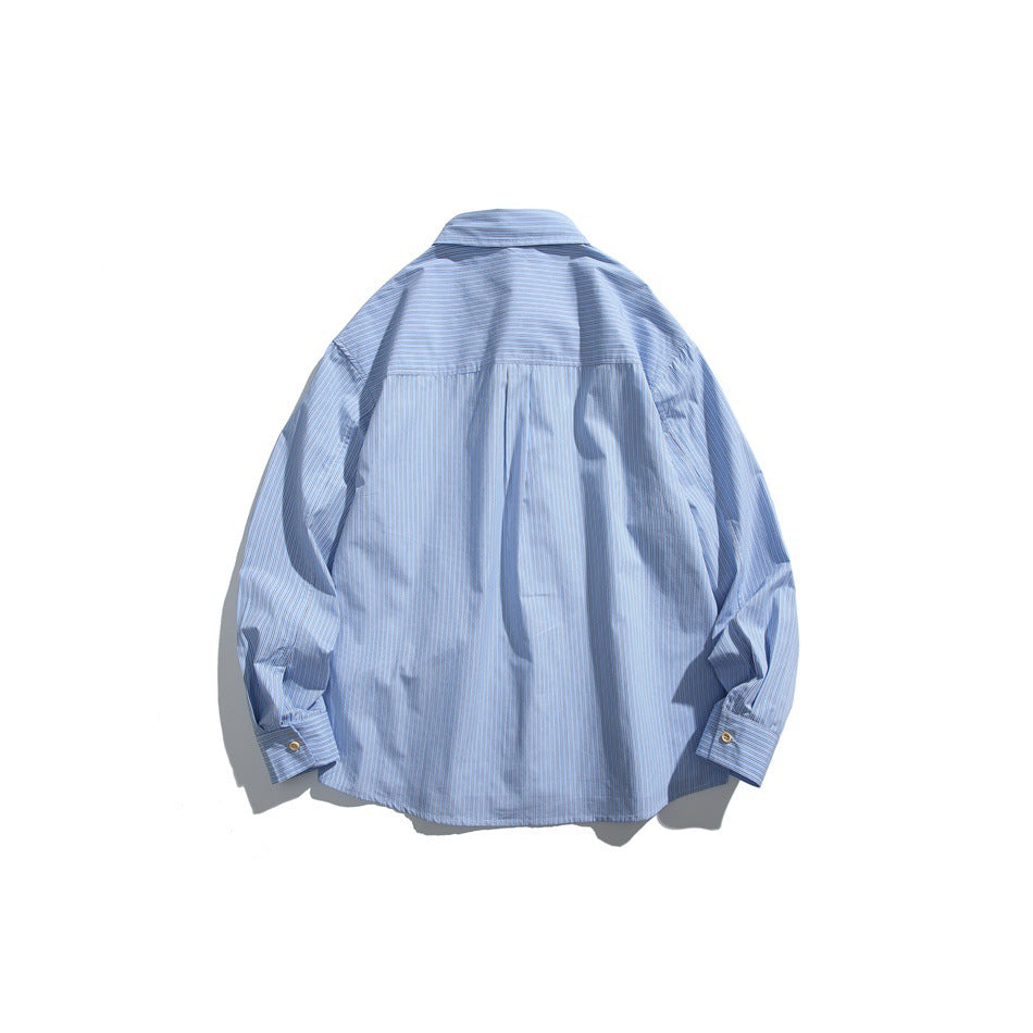 Back view of light blue striped long-sleeve shirt showing yoke seam and buttoned cuffs