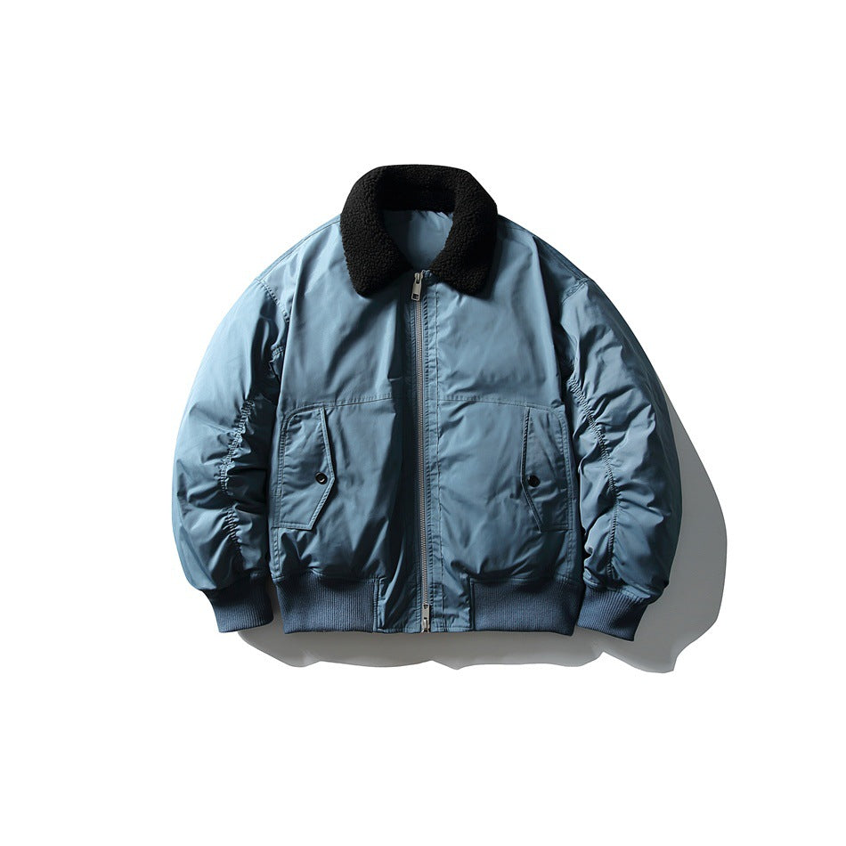 Front view of a light blue bomber jacket with a black textured collar, zip closure, flap pockets, and ribbed trim.