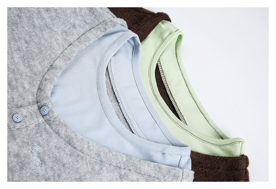 Close-up of layered top necklines in heather gray and pale blue, and dark brown and pale green.