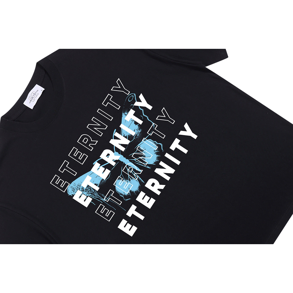Angled flat lay of a black T-shirt with a large blue-and-white “ETERNITY” graphic on the front.
