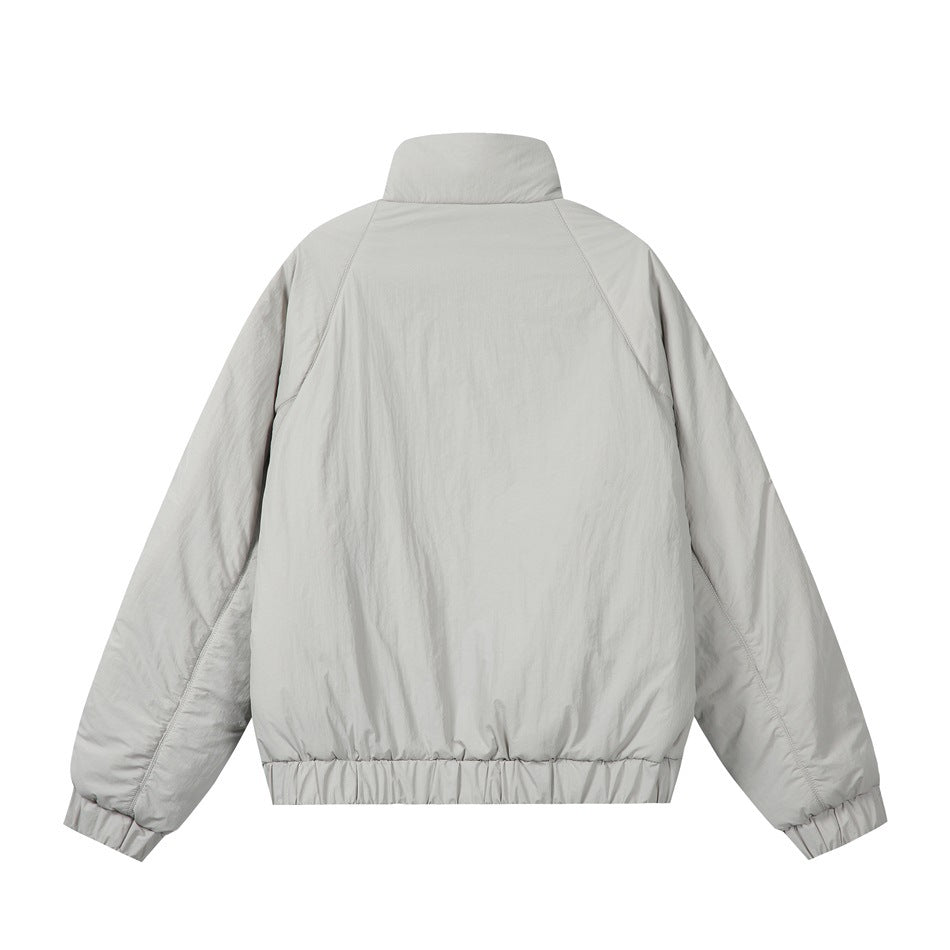 Light gray padded stand-collar jacket, back view with raglan seams and elastic hem and cuffs