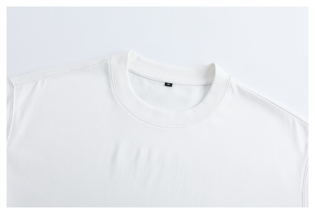 Close-up of the white T-shirt's ribbed crew neckline, shoulder seams, and small M size tag.
