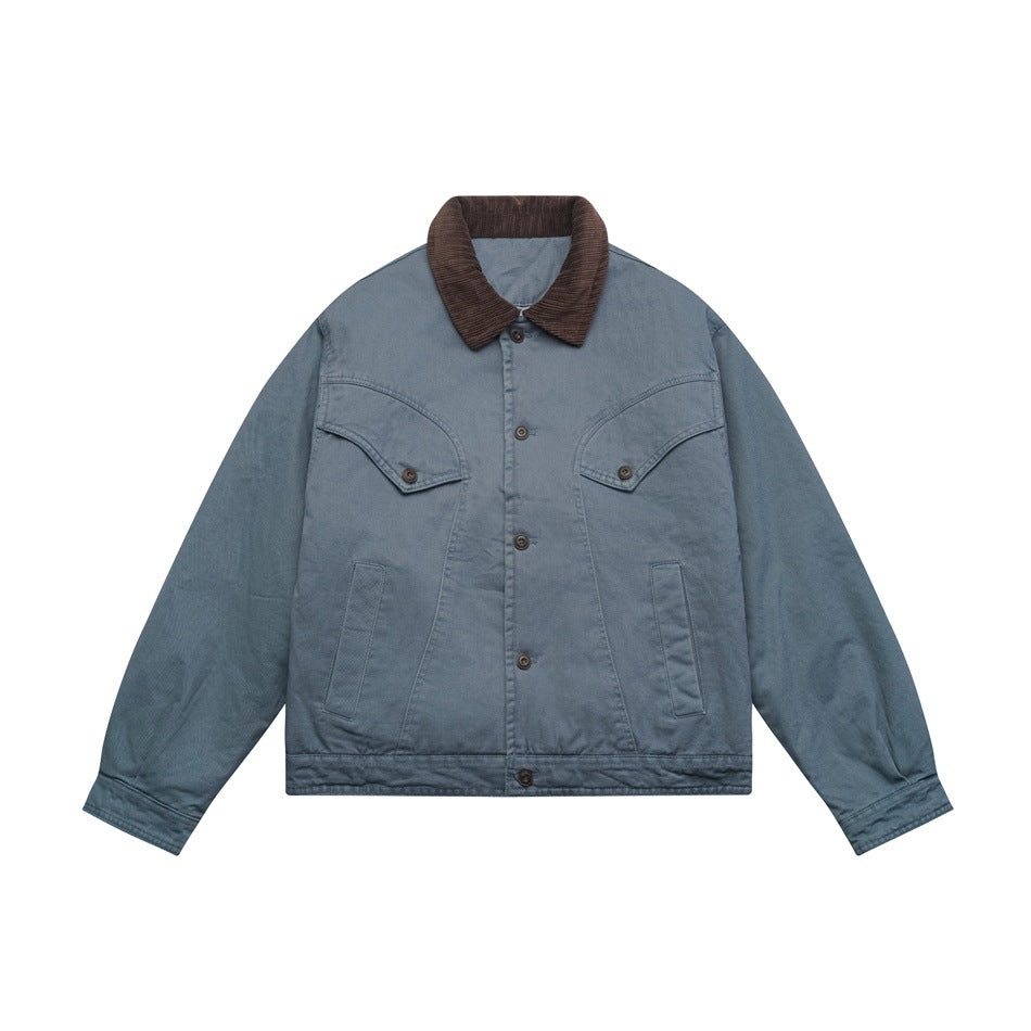 Blue-gray button-front jacket with brown corduroy collar, curved chest flap pockets and front pockets, flat lay