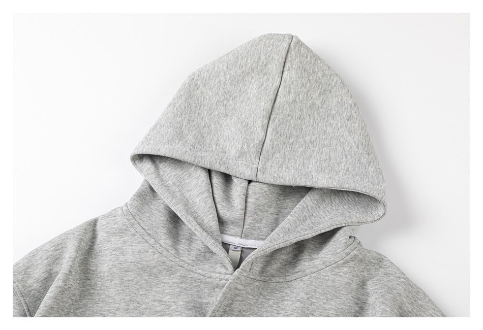 Close-up of the light gray marled hoodie’s hood and front neckline.