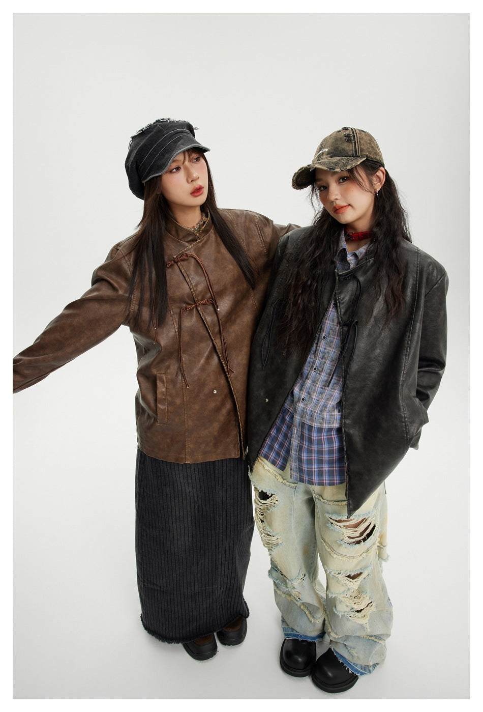 Two models wear a brown and a black mottled jacket with stand collars and decorative tie closures.
