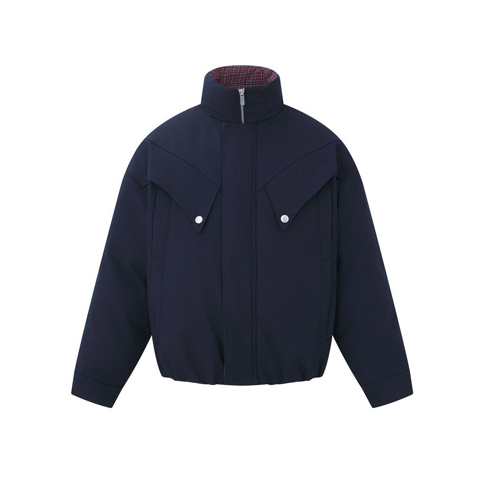 Navy blue stand-collar zip jacket, front view, with angled flap chest pockets, snap buttons and plaid collar interior