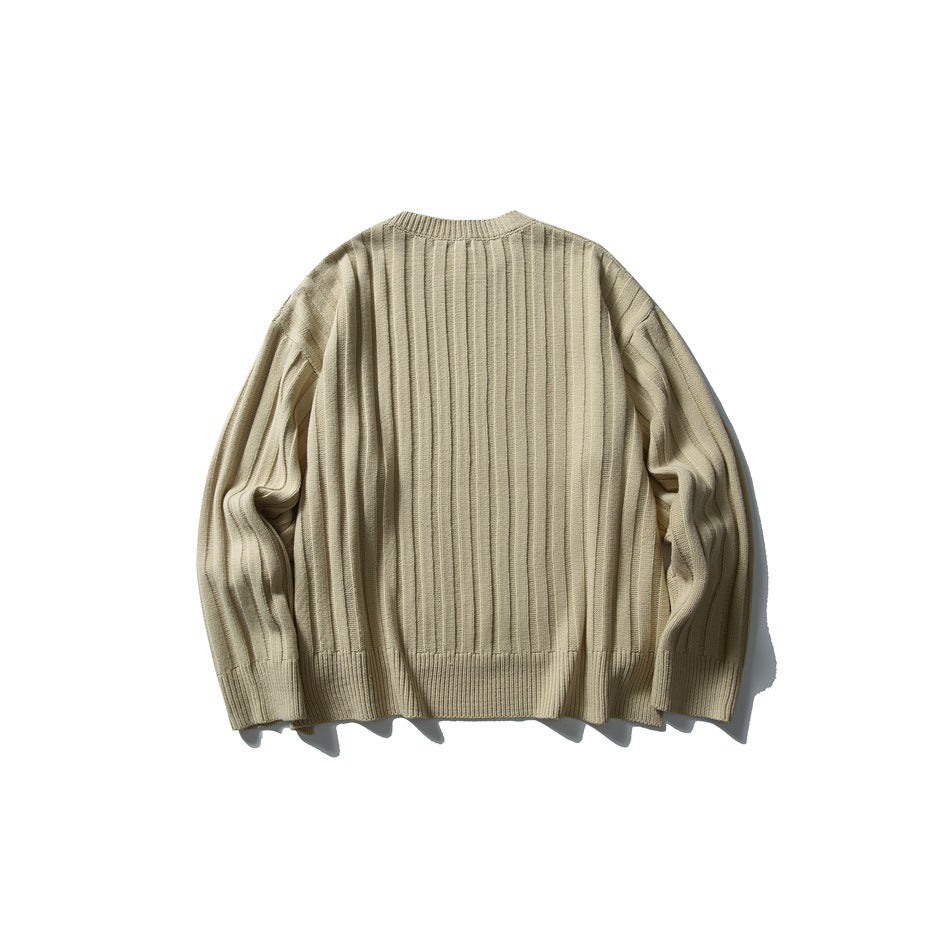 Light beige rib-knit crewneck sweater shown from the back against a white background.