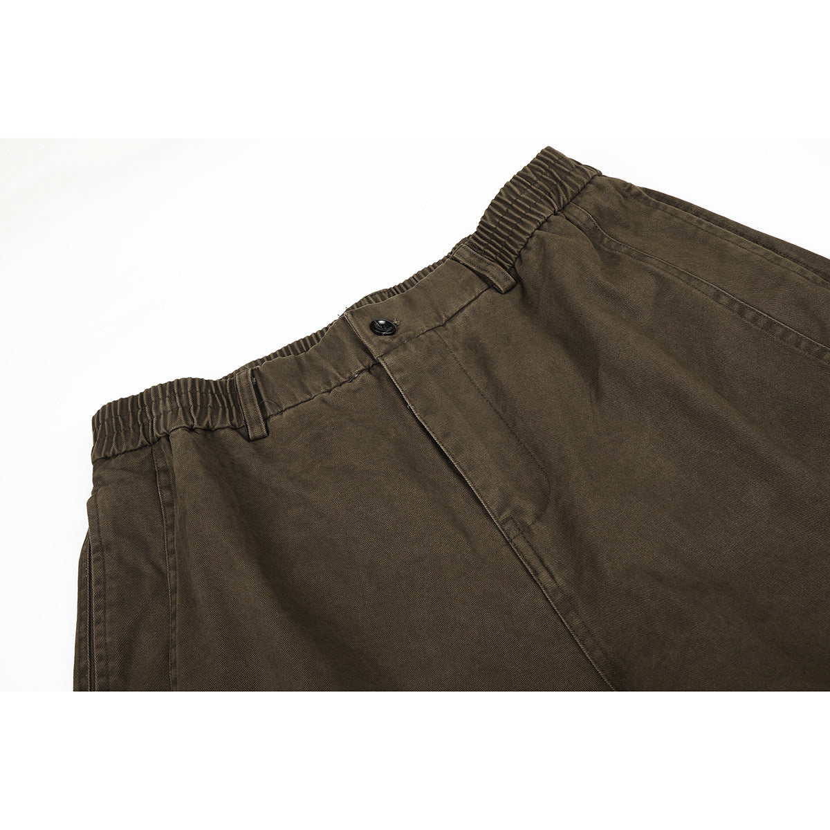 Close-up of olive-brown trousers showing the elastic waistband, belt loops, button, and fly.
