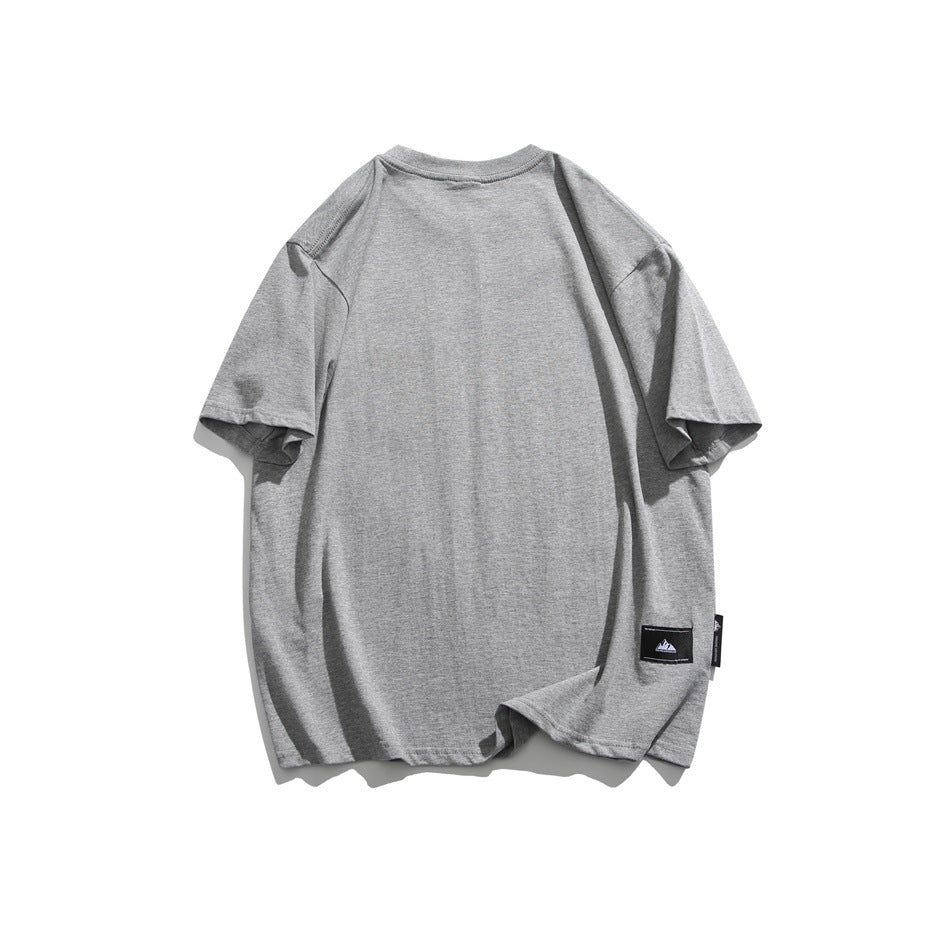 Heathered gray T-shirt back view with small black woven label near the lower hem