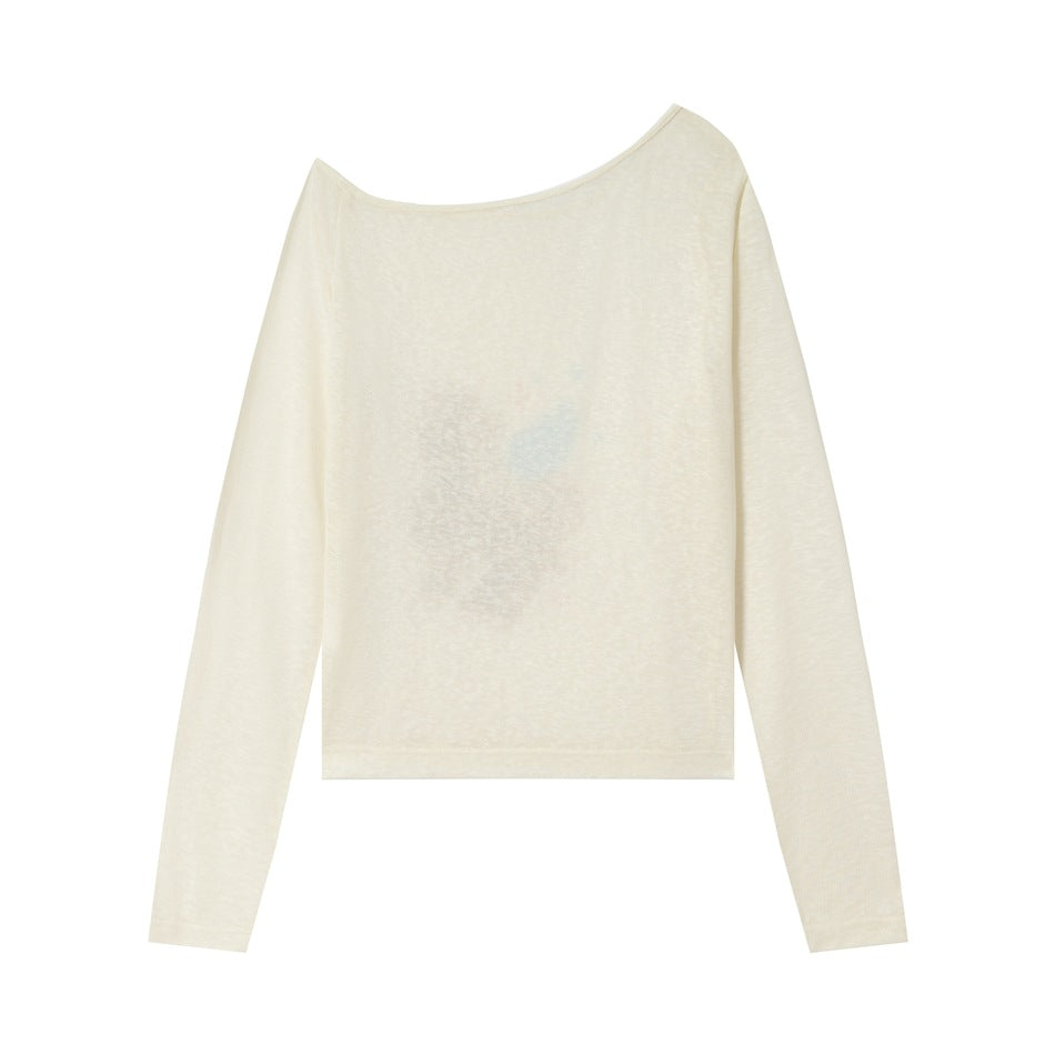 Back view of apricot one-shoulder long-sleeve T-shirt with the front print faintly visible through the fabric