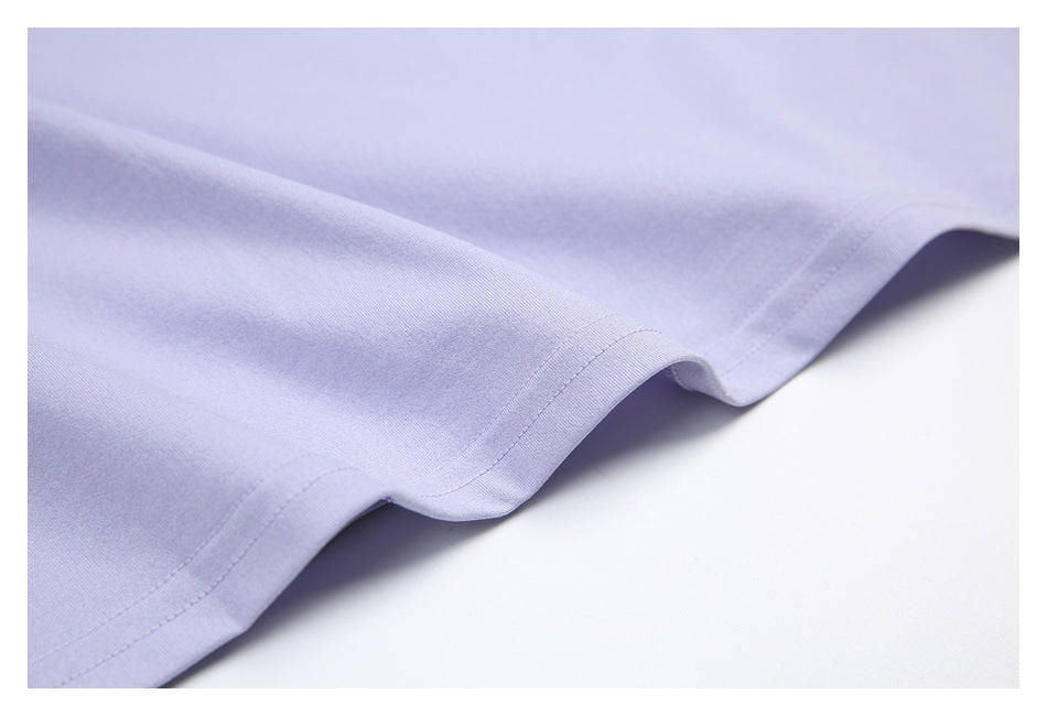 Close-up of the lavender garment's curved hem with visible stitching.