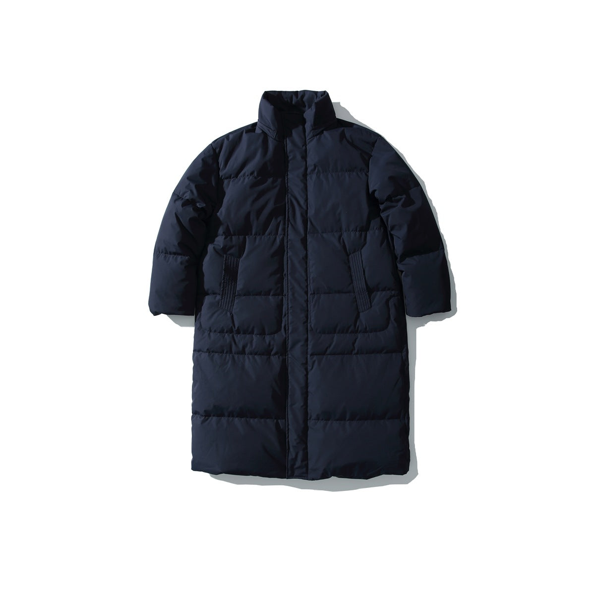 Front view of a long dark navy quilted coat with a high collar and two front pockets.