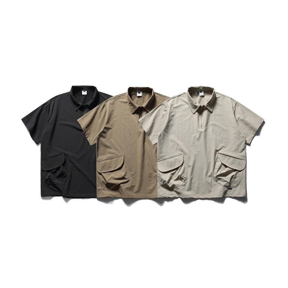 Three short-sleeve collared shirts with front zippers and large flap pockets in black, taupe, and light beige.