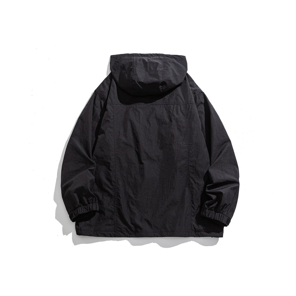 Black hooded jacket back view with seam details and elastic cuffs