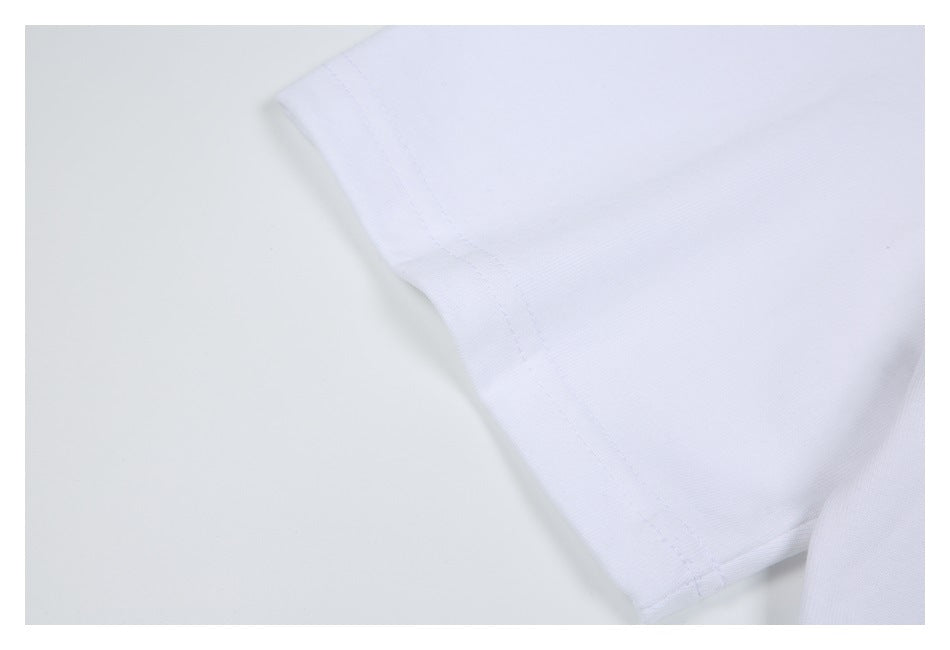 Close-up of the white T-shirt sleeve edge and seam stitching.