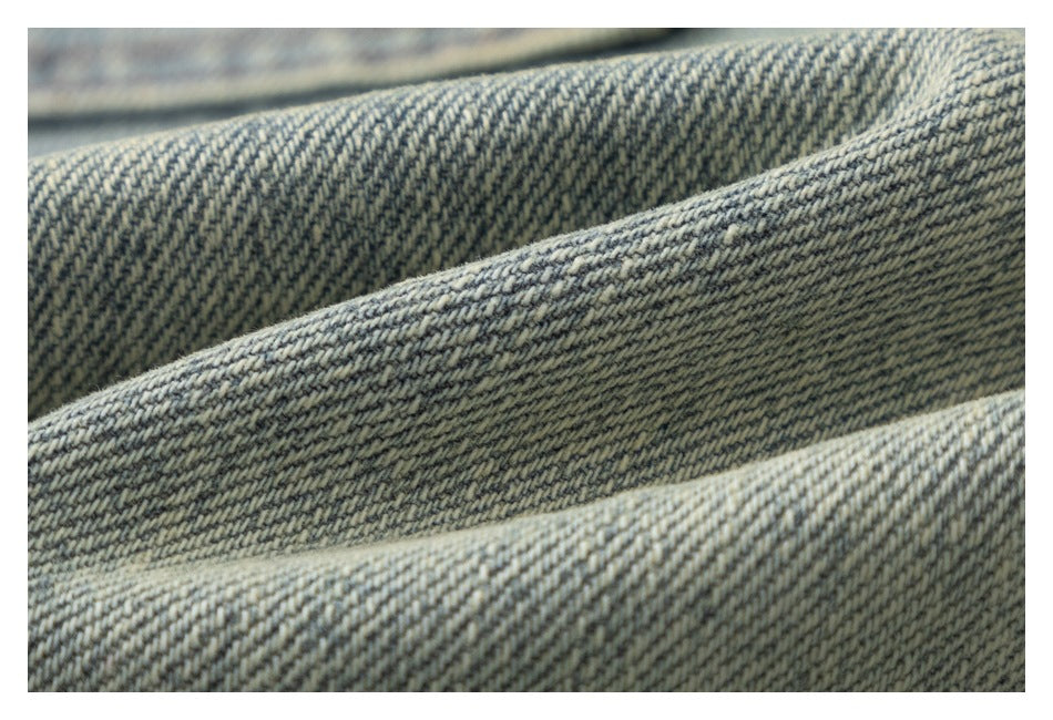 Macro view of the diagonal twill weave in blue-gray denim.
