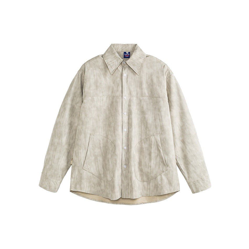 Front view of a light beige mottled long-sleeve button-up shirt with a pointed collar and two large lower pockets.