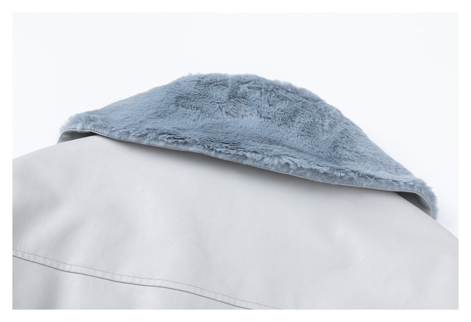 Close-up of a pale gray jacket collar with soft gray plush lining.