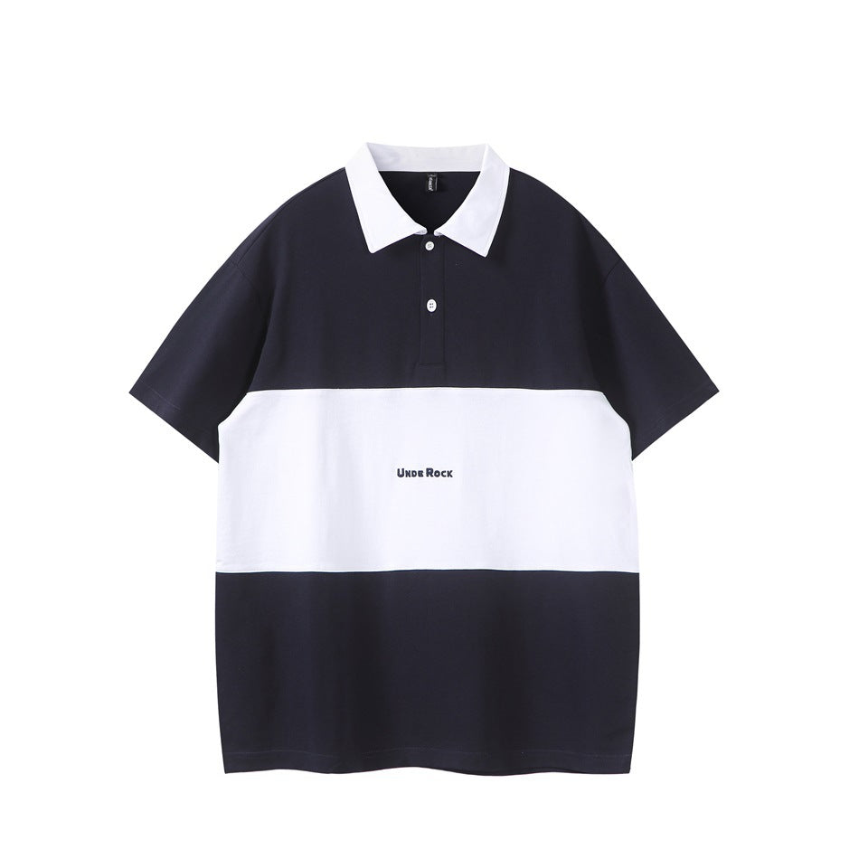 Navy short-sleeve polo shirt with white collar, white horizontal band, two white buttons and a small navy chest print