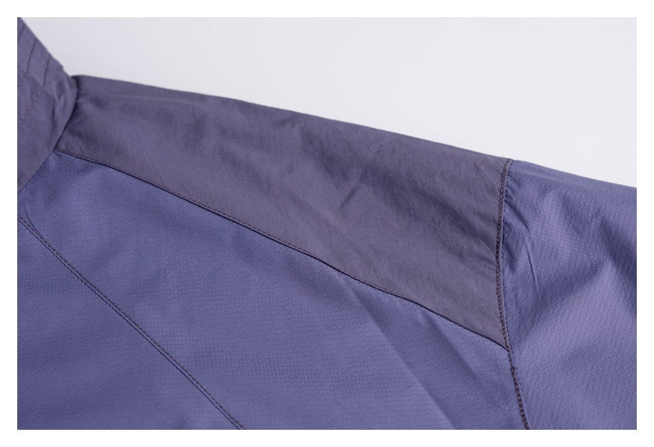 Close-up of stitched lavender garment panels and a darker purple overlay.