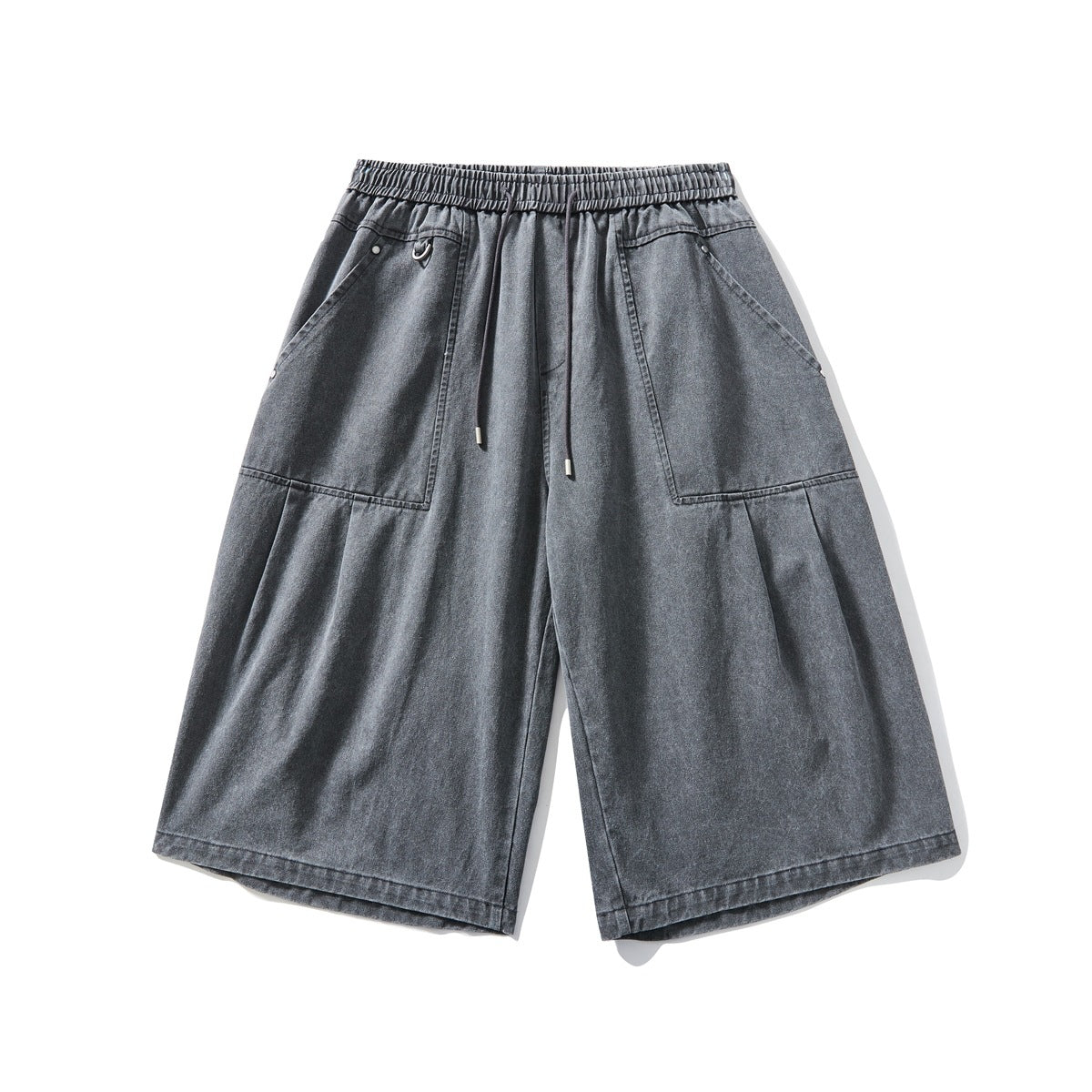 Black-gray washed wide-leg knee-length shorts with drawstring waist, large front pockets and pleats, flat lay front view