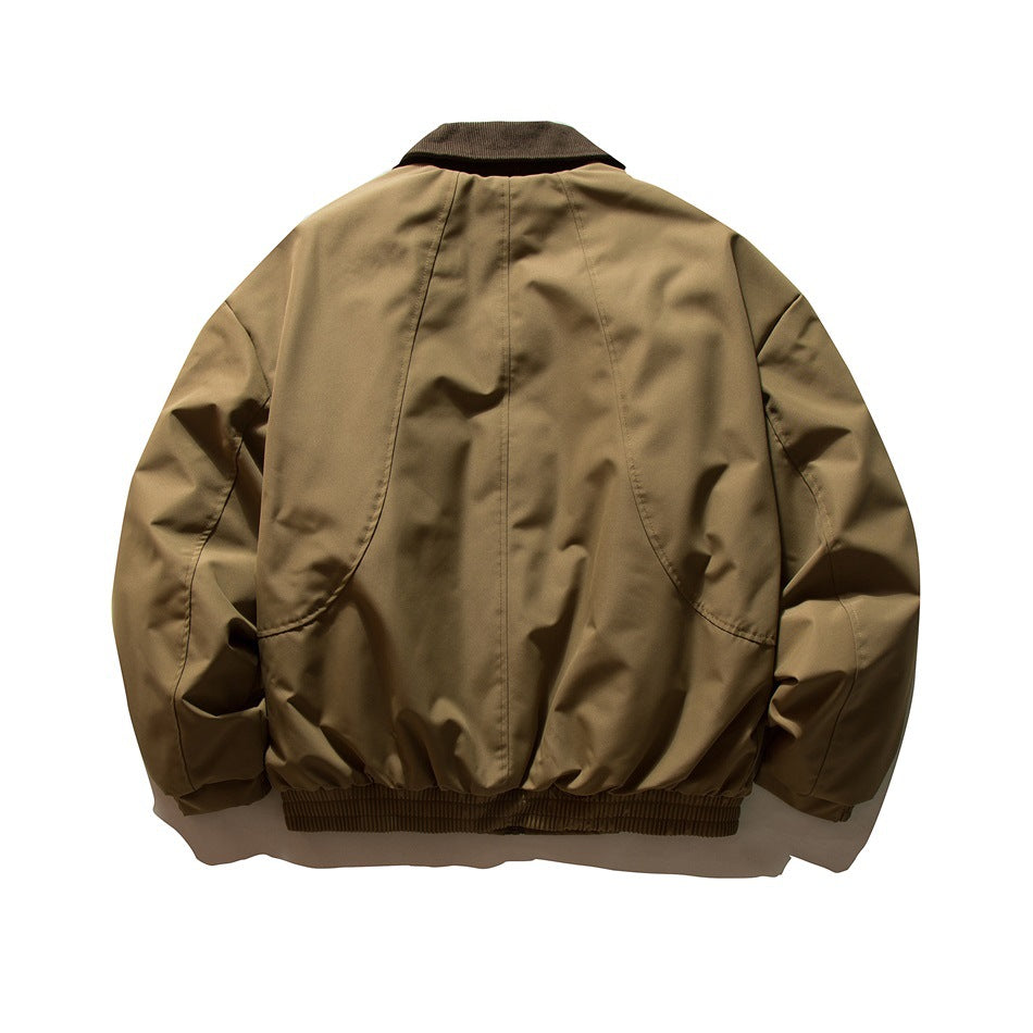 Back view of khaki bomber-style jacket with curved panel seams, brown collar and ribbed hem