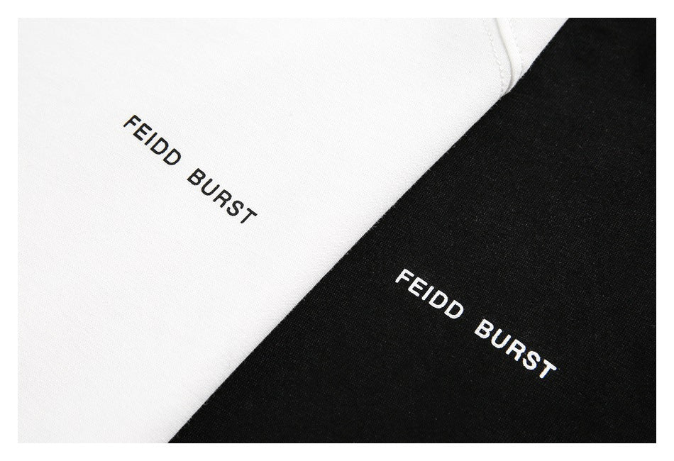 Close-up of white and black shirt colorways, each printed with “FEIDD BURST.”