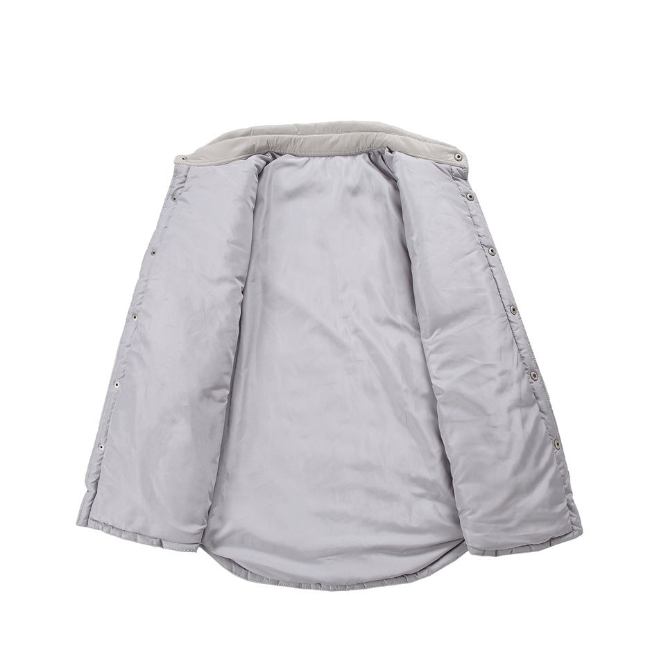 Light gray jacket laid open to show its plain lining and snap fasteners along the edges.