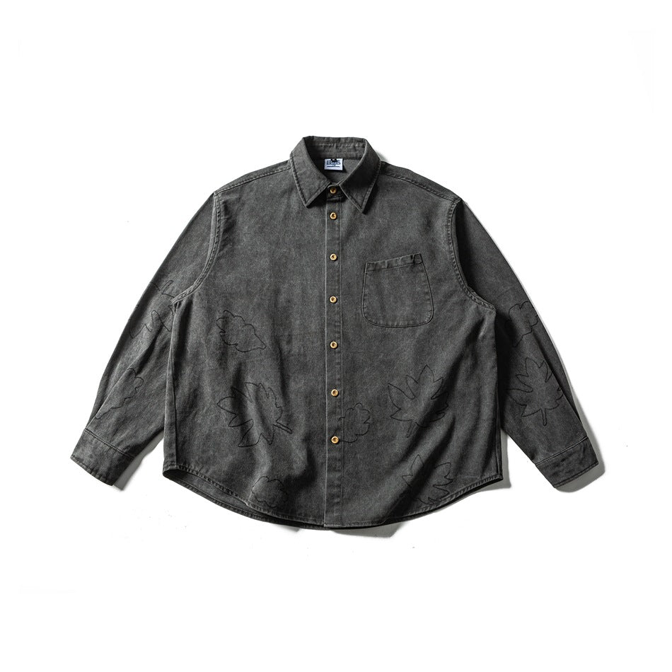 Dark gray washed long-sleeve button shirt with chest pocket and outlined leaf embroidery, flat lay front view