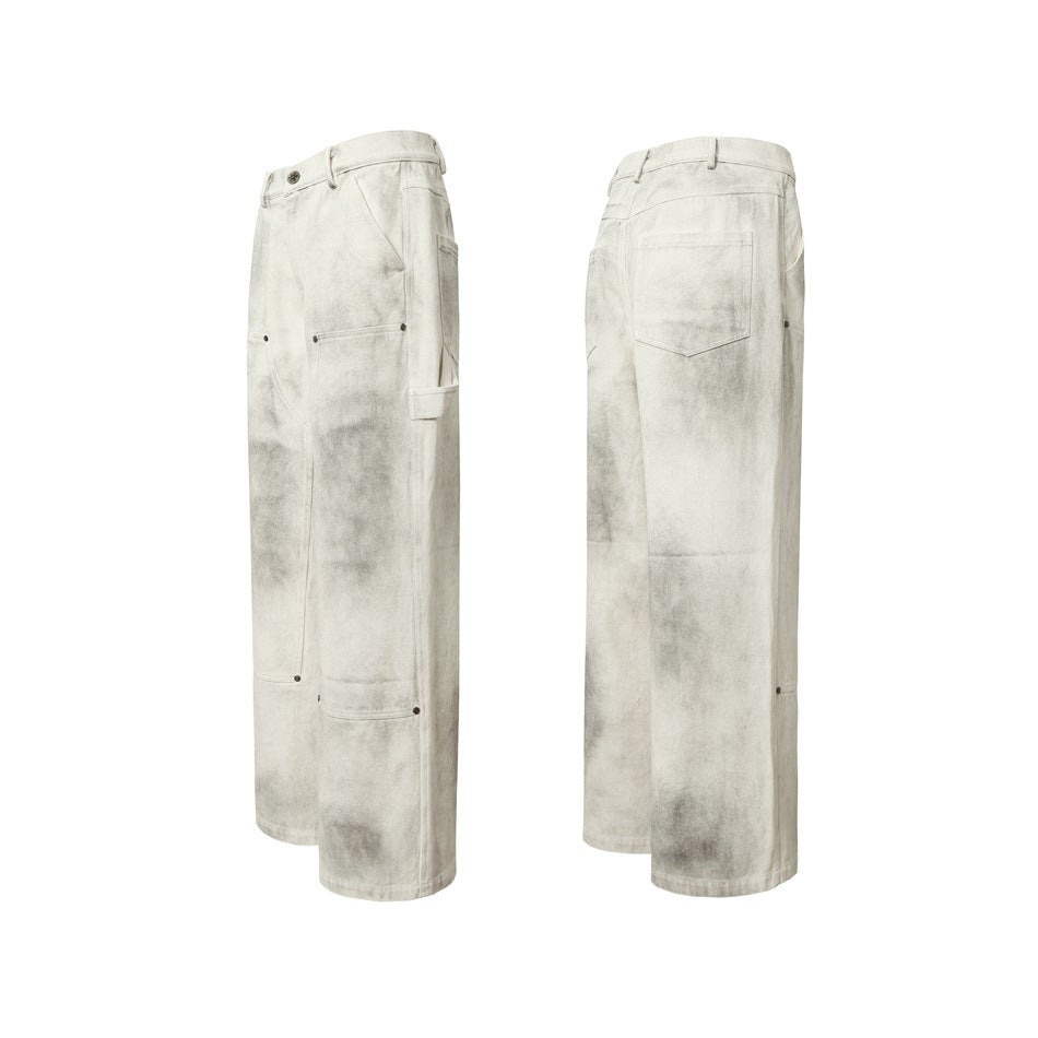 Off-white wide-leg pants shown from angled front and rear views, with gray mottling, utility panels, and a back pocket.