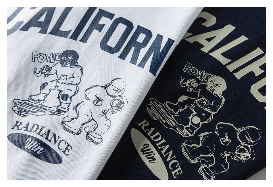 White and navy T-shirts with large English lettering and illustrated figures printed on the front.