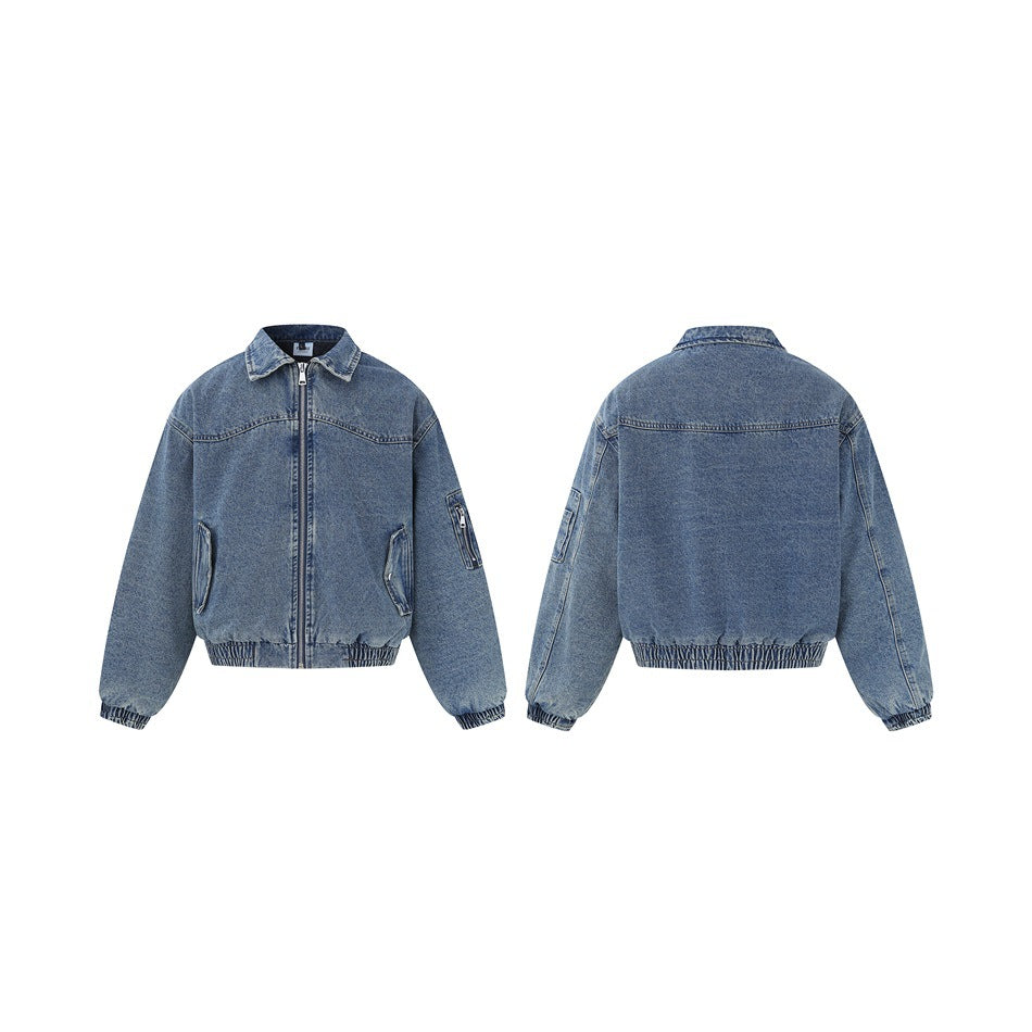 Blue denim zip jacket shown front and back side by side, with sleeve zip pocket and elastic hem