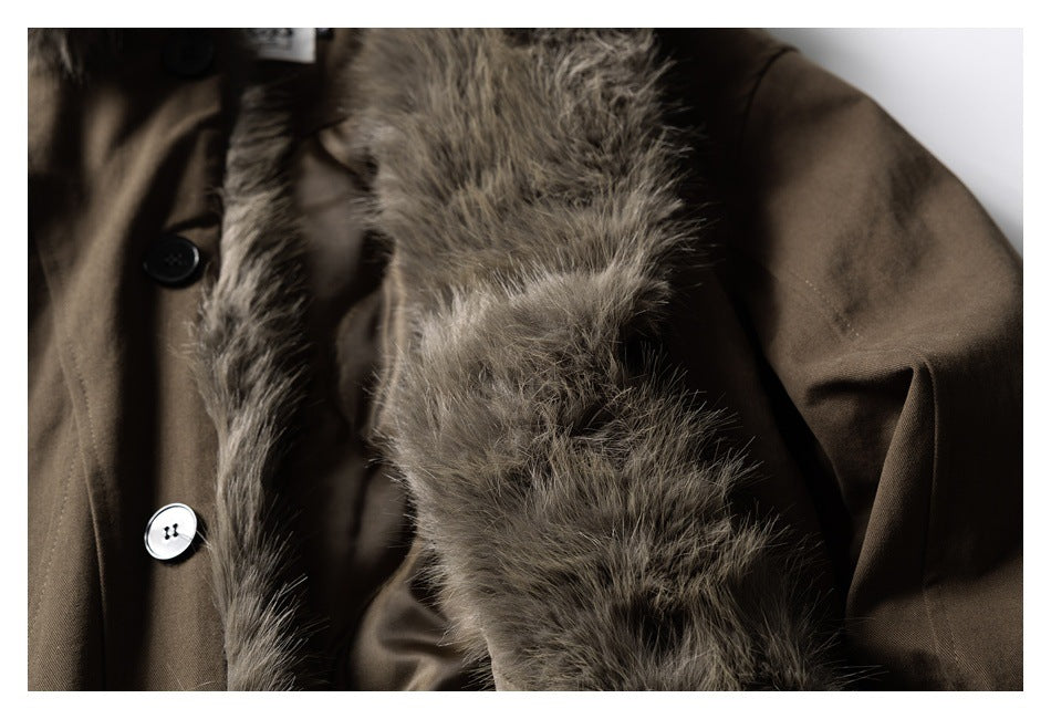 Close-up of a brown coat with gray-brown fur trim and contrasting dark and light buttons.