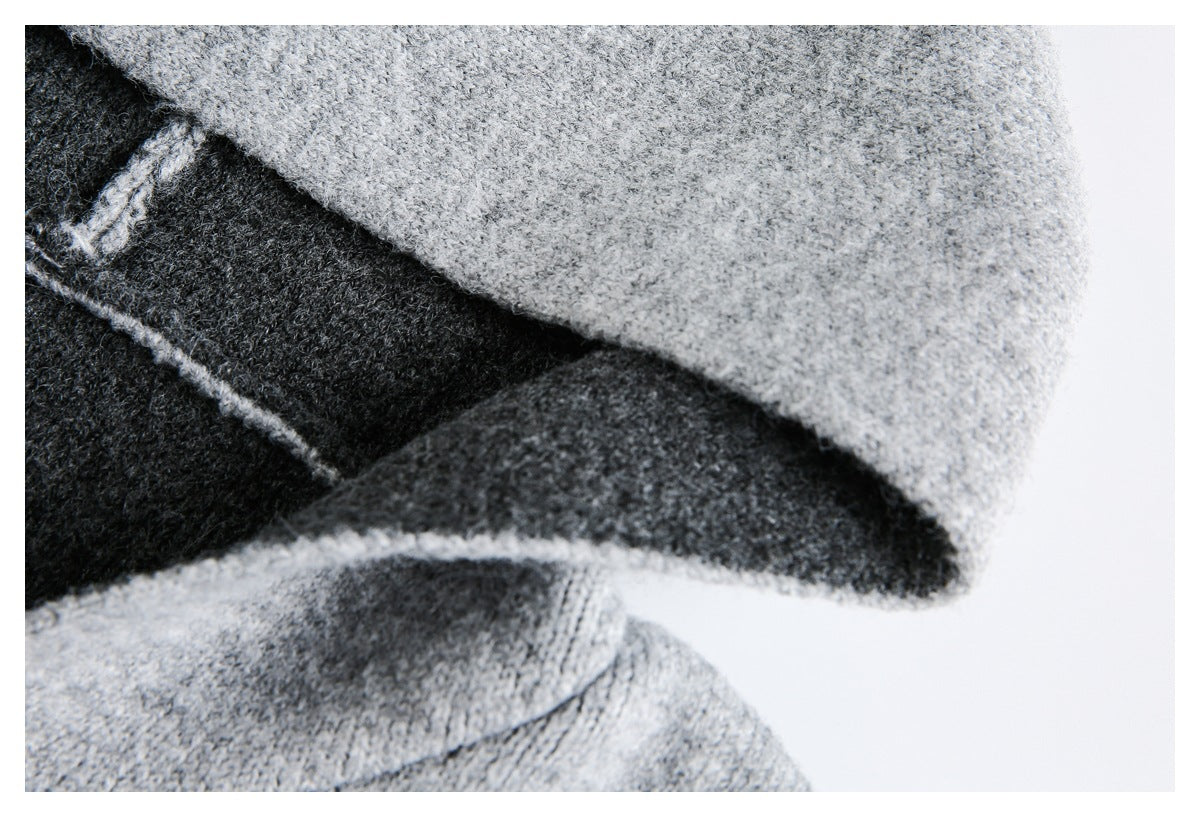 Close-up of the gray hood edge and charcoal lining on a knit garment.