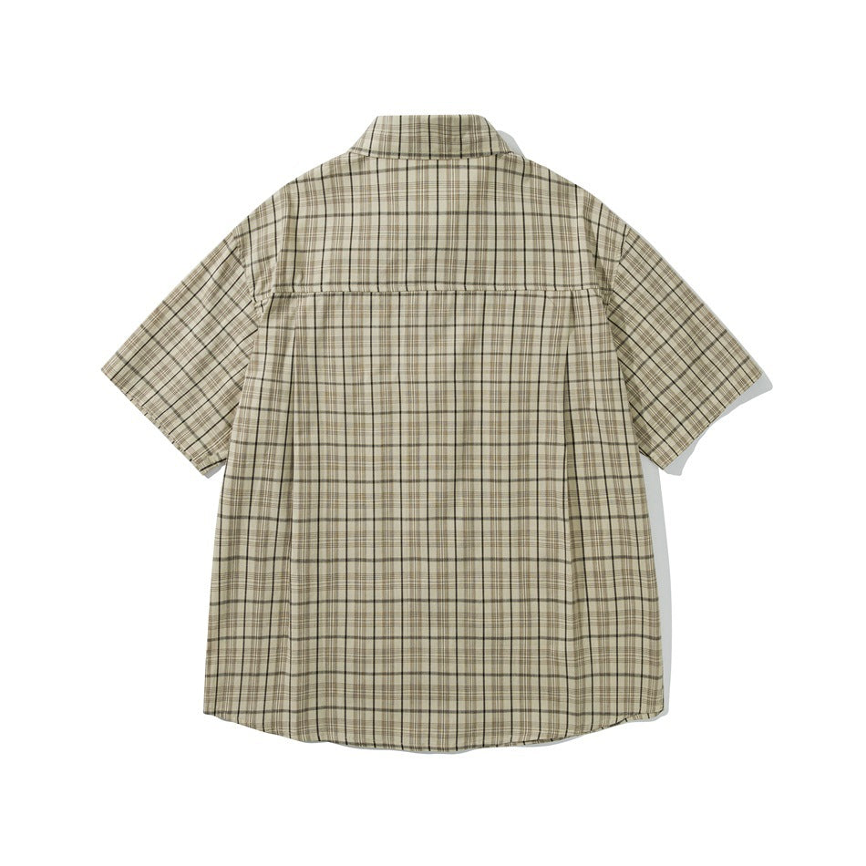 Back view of a beige plaid short-sleeve button-up shirt with a horizontal yoke seam.