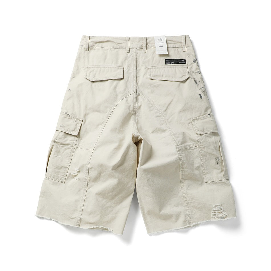 Off-white cargo shorts, back flat lay, with two flap back pockets, curved seams, side cargo pockets and a frayed hem