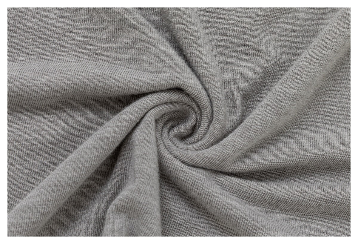 Close-up of gray knit fabric gathered into a spiral of folds.