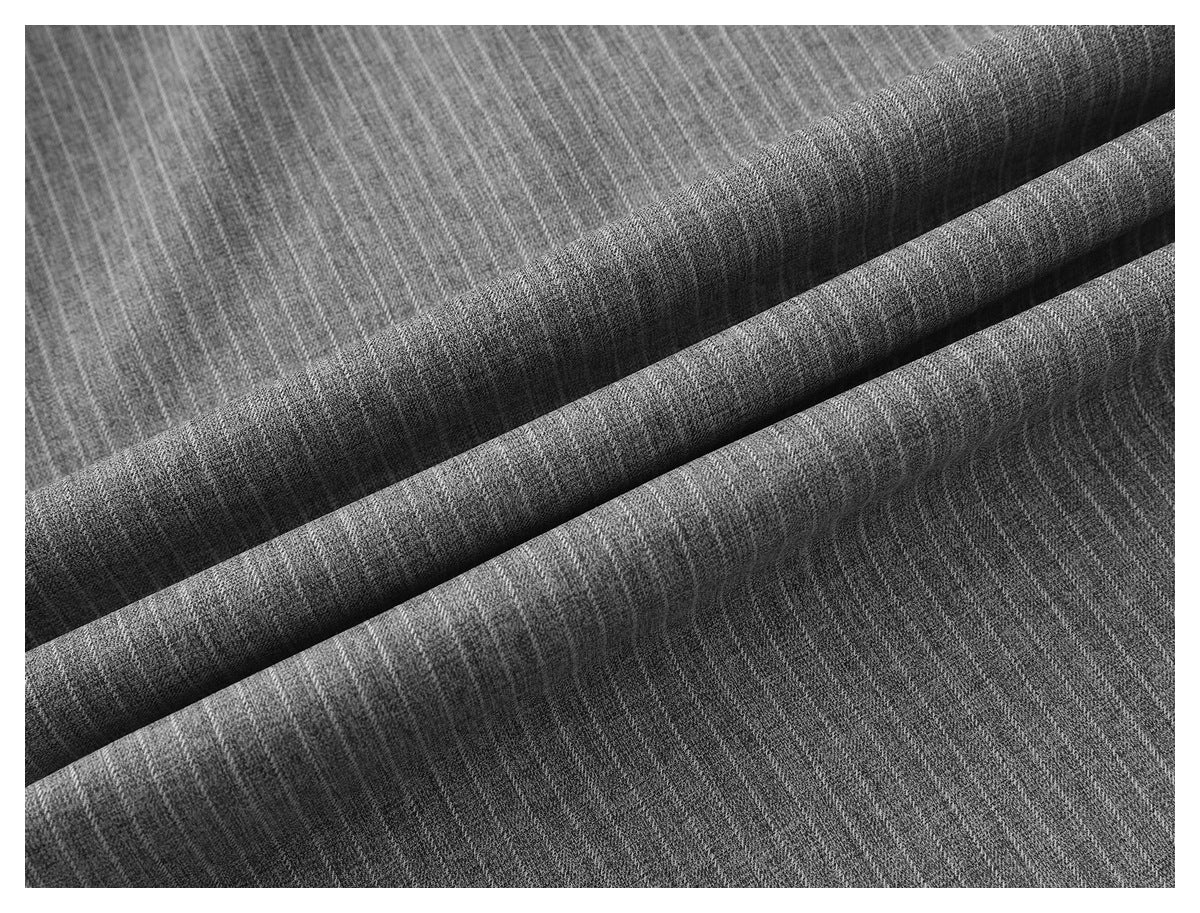 Close-up of gray pinstriped trouser fabric arranged in soft folds.
