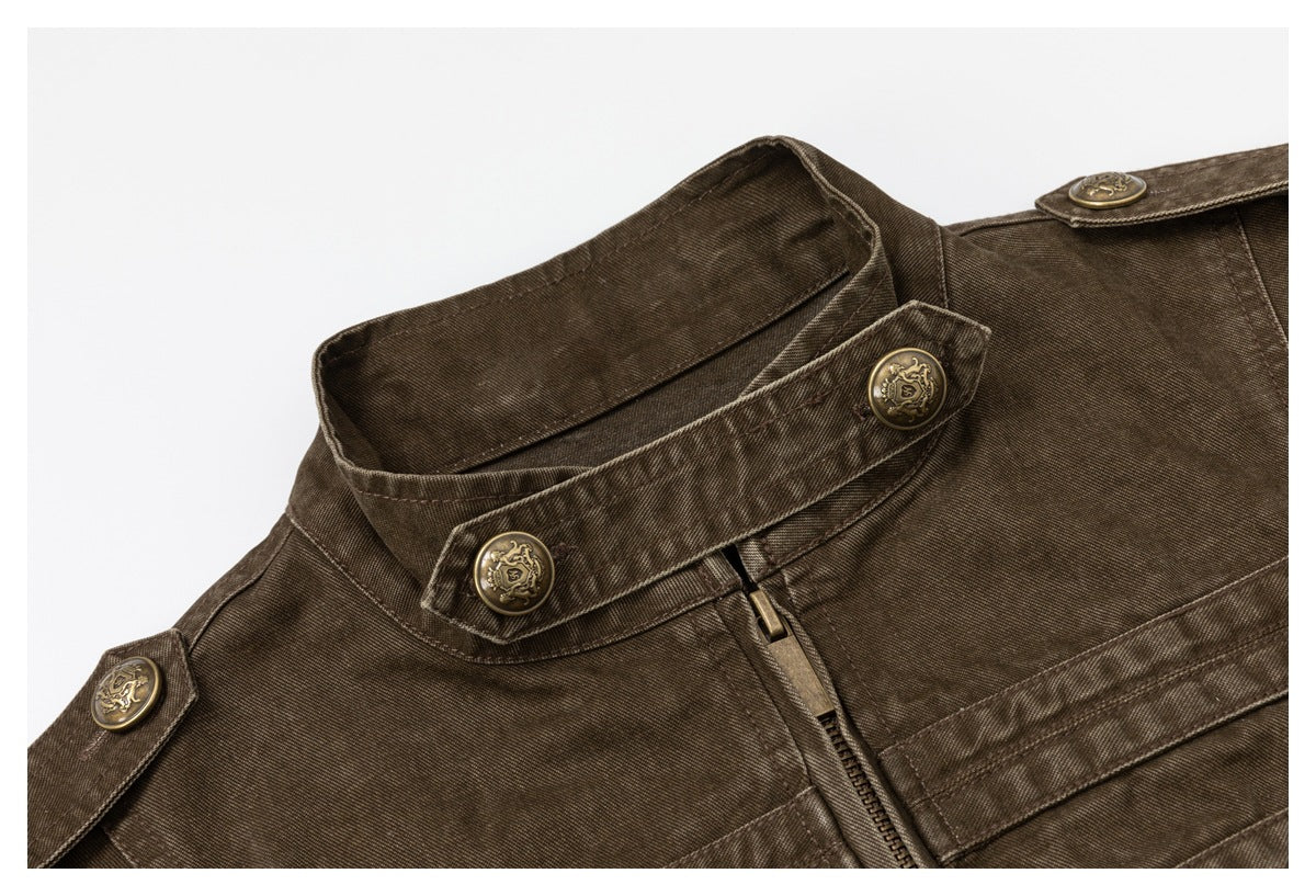 Close-up of the jacket's high collar, zipper, shoulder tab, and ornate buttons.